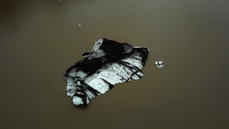 Aerial-view-of-an-iceberg-detached-from-Sólheimajökull-glacier,-Iceland,-in-summer