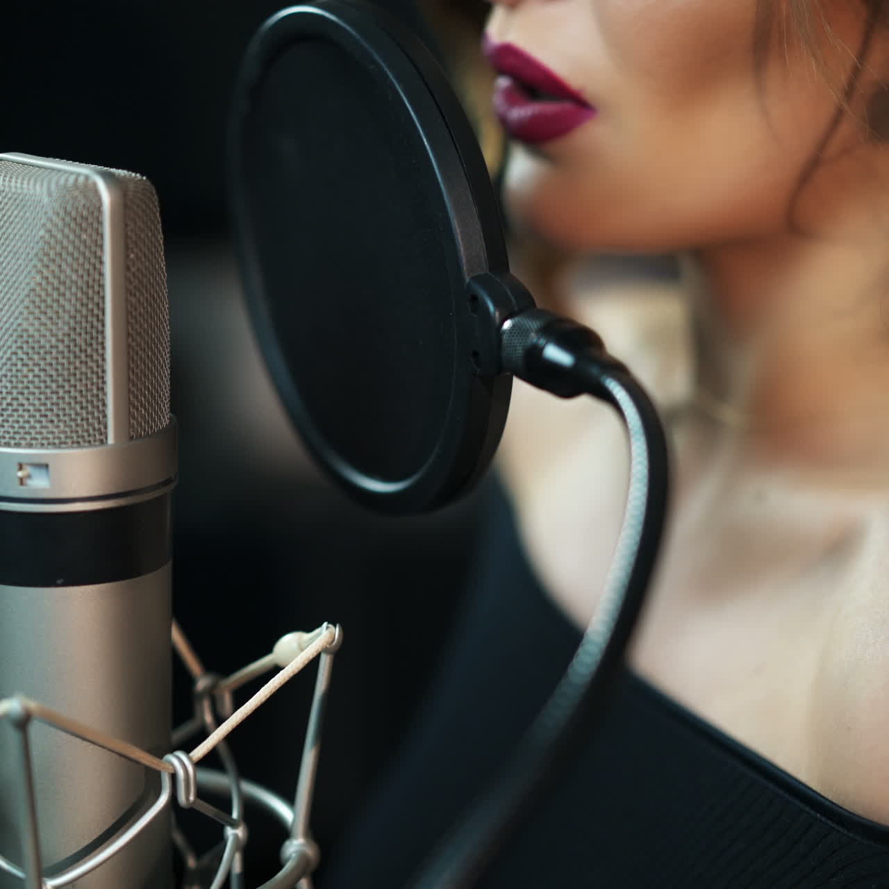 Beautiful sexy young woman singing. Female vocal. Professional recording studio. Square video