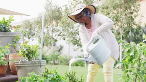 Happy-senior-african-american-woman-working-in-garden