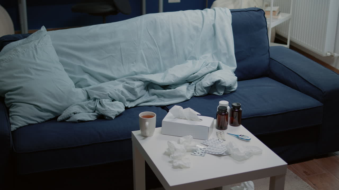 Empty living room with medicine against virus infection on table