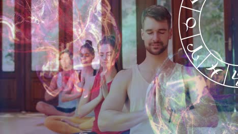 animation of horoscope zodiac wheel over diverse people practicing yoga