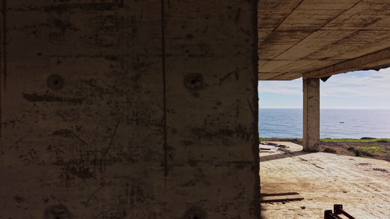 Ocean view from an unfinished coastal building during daytime