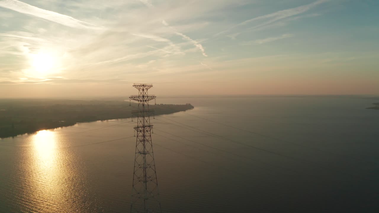 High voltage line tower on a sunny evening