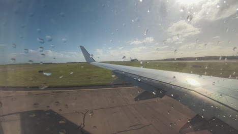 plane taxiing on runway before take off. brisbane, queensland. a view from airplane window