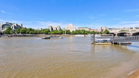 calm river scene with boats and buildings