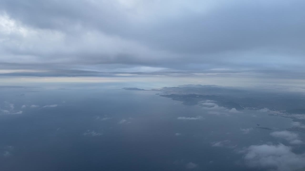 flying between layers of clouds near Ibiza island