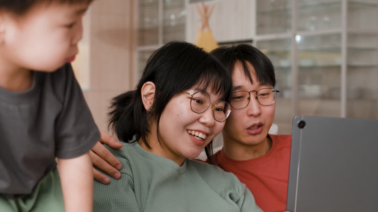 Family using a tablet together at home