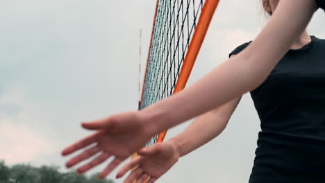 Close-up-greeting-the-hands-of-girls-volleyball-players-thanking-the-opponent-for-the-last-match-in-slow-motion