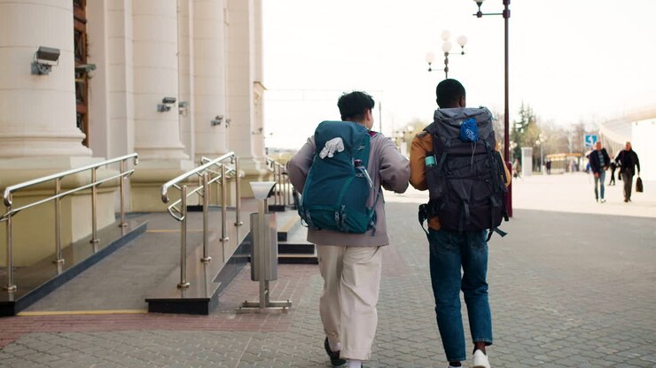 Friends walking towards the train station