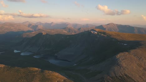 mountain peaks and lakes at sunset