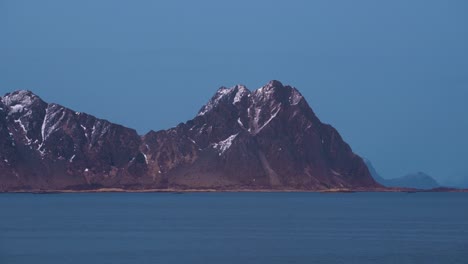 a clip of a mountain in the distance located in the sea