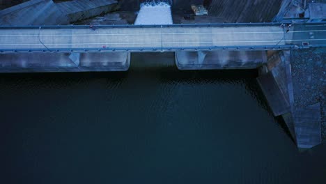 Fly-over,-top-down-view-of-Hinze-dam-during-overflow,-Queensland-Australia