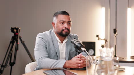 man recording podcast in studio