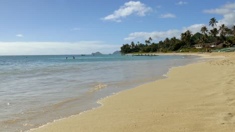 tropical beach scene with people and canoes