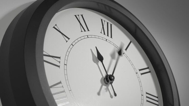 Latin Clock Face in Time Lapse on White Wall
