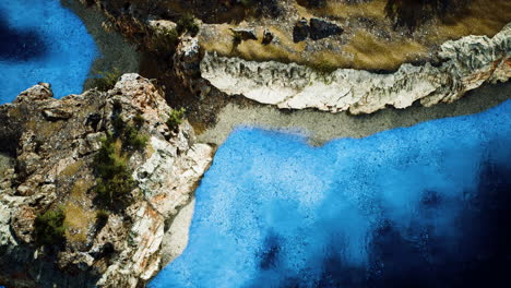 aerial view from flying drone of rocky island in atlantic ocean