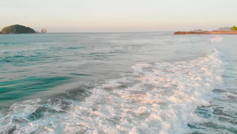 seashore, as the waves break