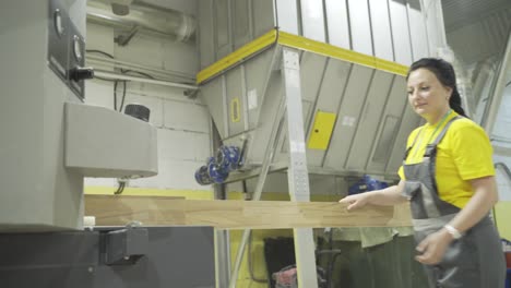 woman working in wood processing facility