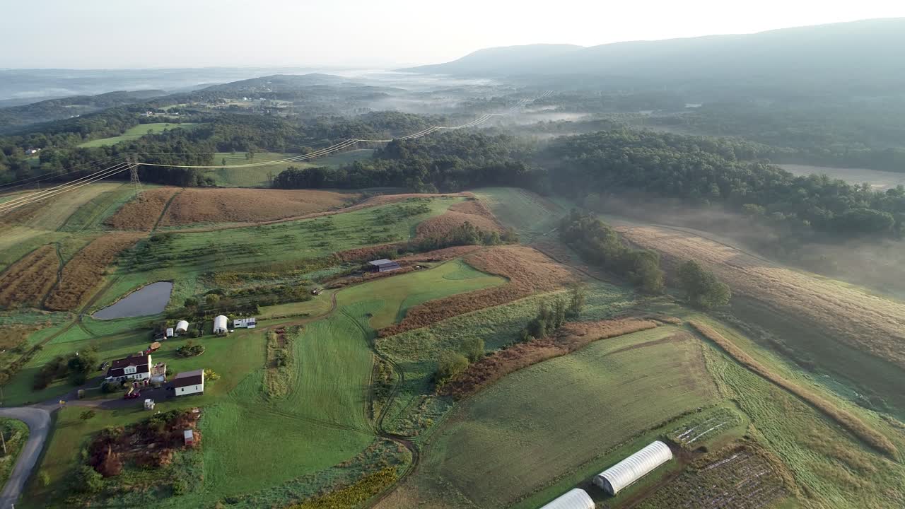 Aerial view of a farm with morning fog