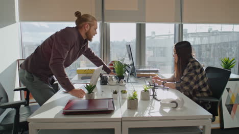 Creative-team-discussing-computer-office-closeup.-Freelance-man-looking-screen