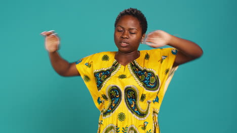 Natural-sweet-woman-stretching-her-back-and-arms-muscles-in-studio