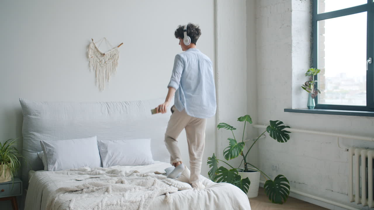 Woman Dancing in Bedroom with Headphones