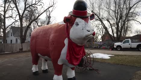 red and white cow statue.