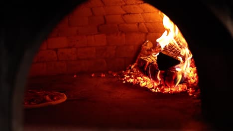 pizza baking in a wood-fired oven