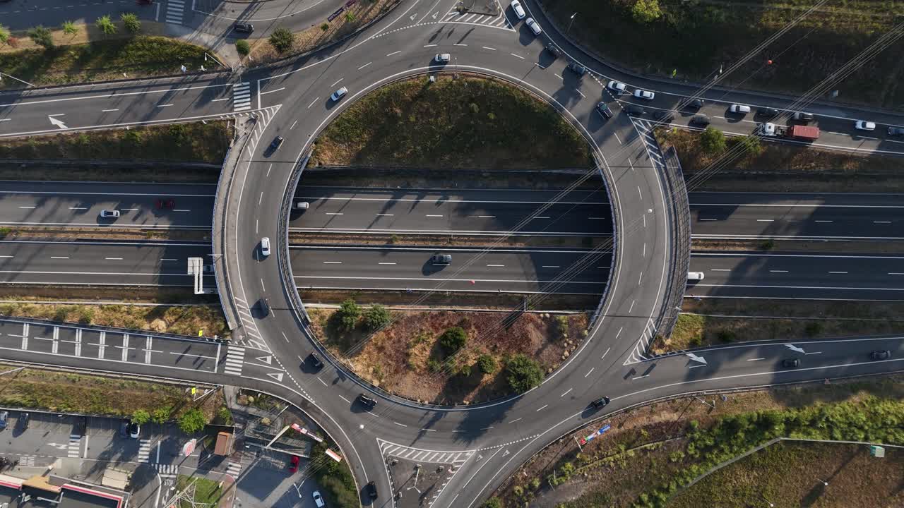 Highway exit rush hour on roundabout with sun setting