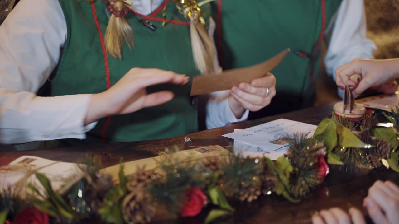 Lot of letters with wishes for Santa. Children help elves to prepare letters for other kids from Santa Claus