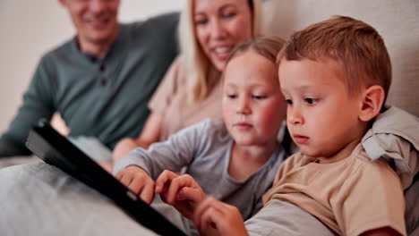 parents, children and tablet in bedroom