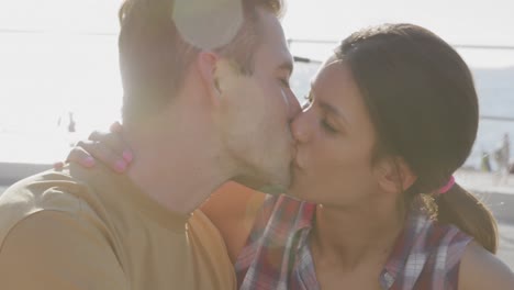 young adult couple relaxing at the seaside