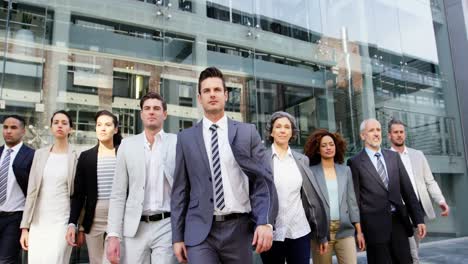 business people walking in office building