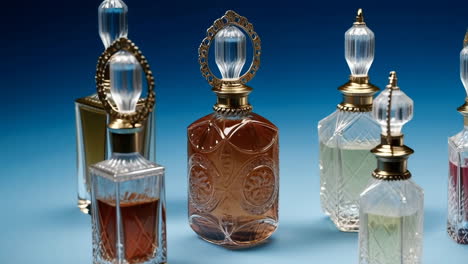 collection of ornate perfume bottles on a blue background