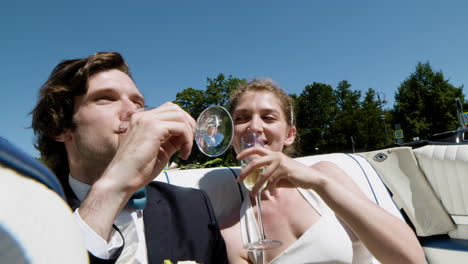 Just-married-couple-in-a-blue-convertible-car