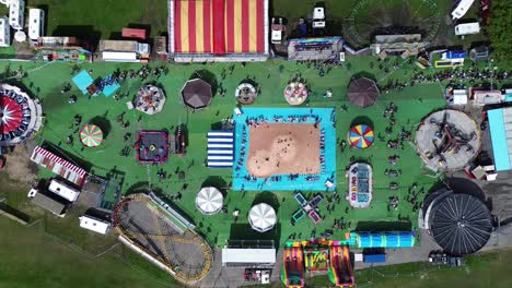 4k30p drone aerial view amusement park carnival carousel recreation playground