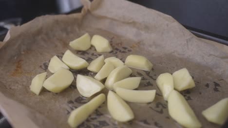 Sliced-​​potatoes-on-a-baking-sheet