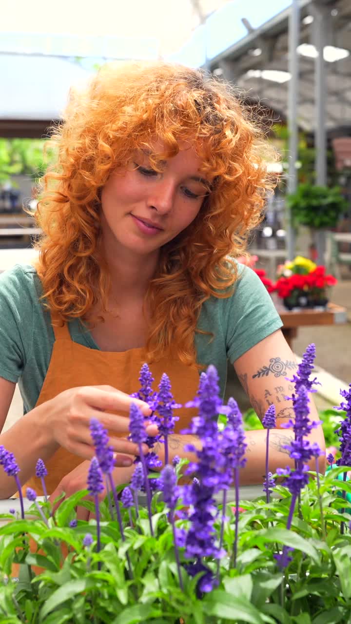 Woman with flowers in a greenhouse