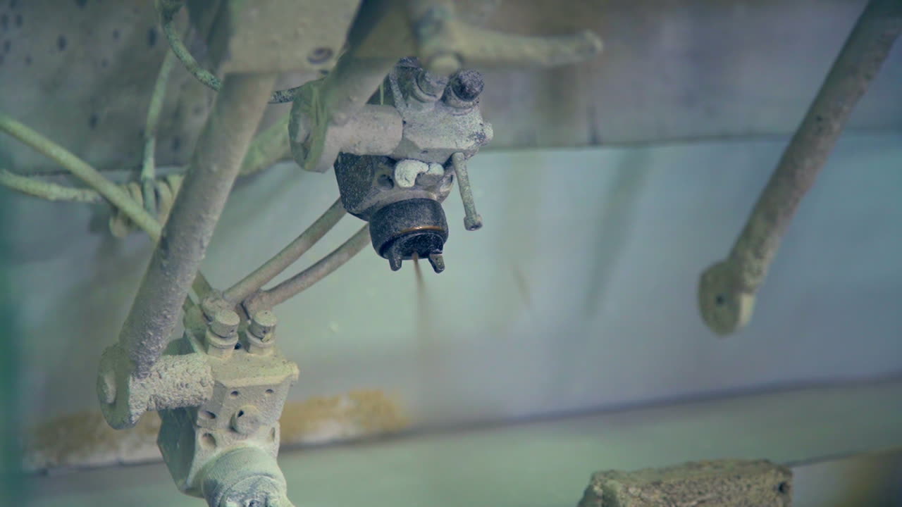 Spraying machine for applying varnish or paint on the product. Equipment at modern door manufacturing enterprise.