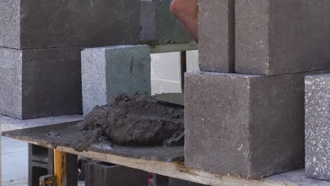 large pile of mud grout on a custom built scaffold