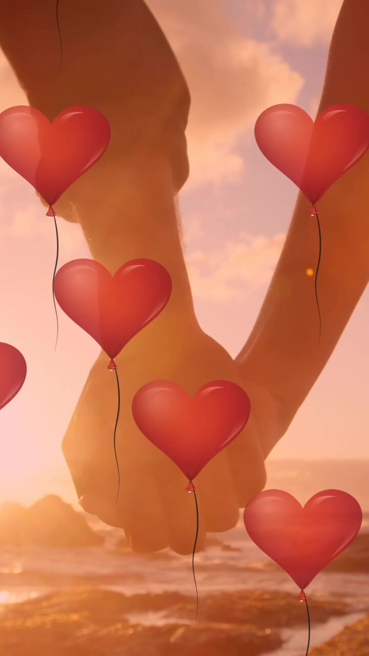 Diversi palloncini a forma di cuore che fluttuano sulla parte centrale di una coppia che si tiene per mano.