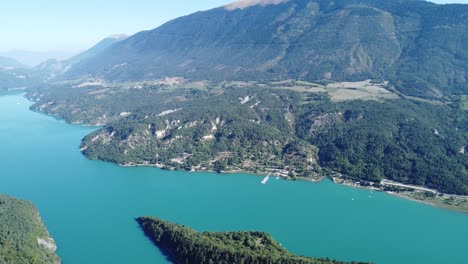 lake monteynard in france, near grenoble, amazing blue water color in between green stunning landscape