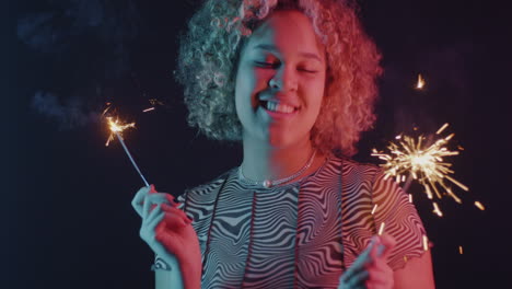 woman with sparkler in neon light