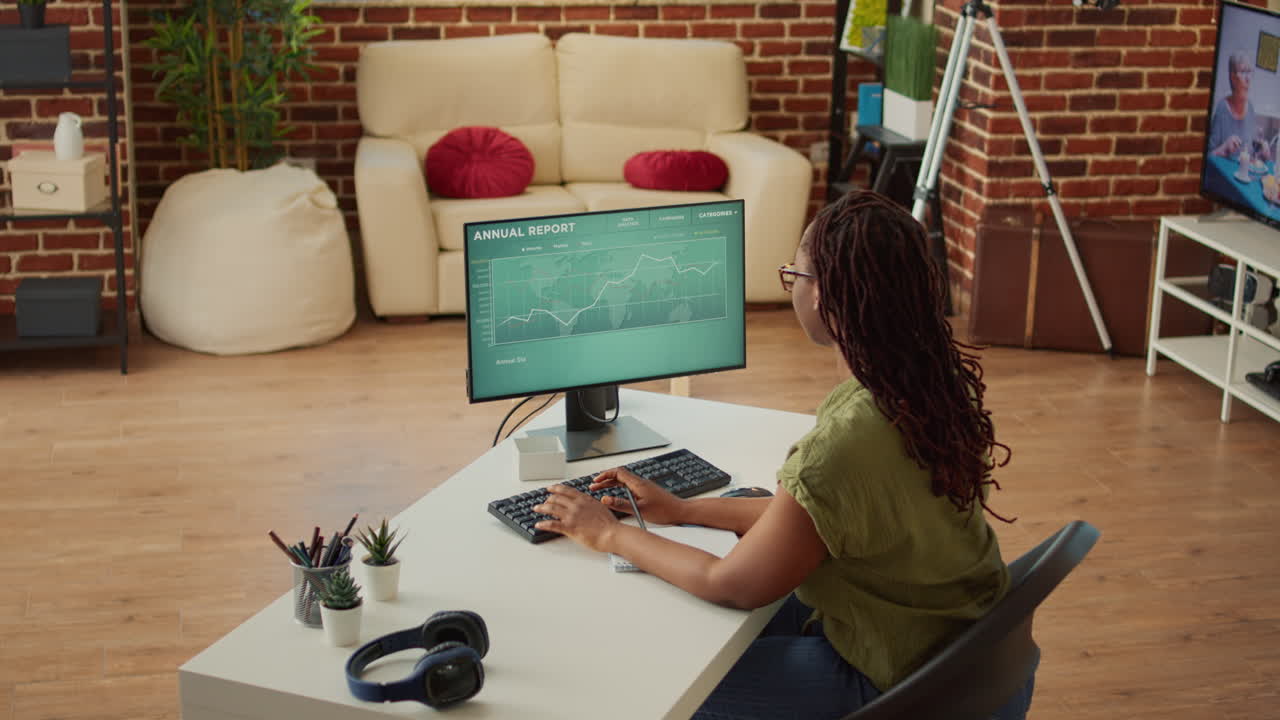 Office worker checking diagrams report and taking notes