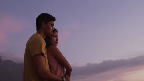 young couple enjoying the sunset view