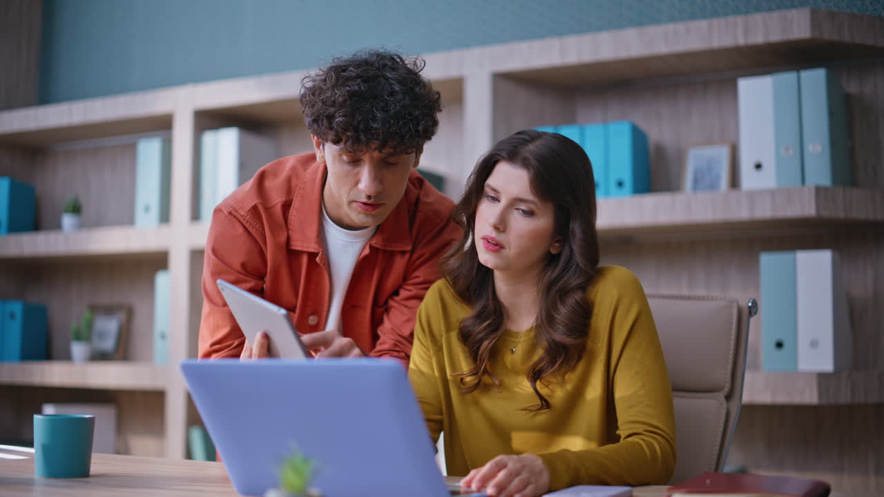 Office partners solving problem at agency workplace closeup. Worried woman man