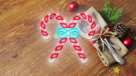 animation of flickering christmas sugar cain over table setting