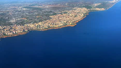 a view out of the airplane window during the landing approach in antalya in turkey