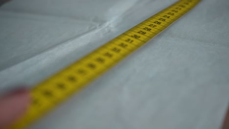 Fashion-Measurements.Measuring-with-a-measuring-tape-before-sewing