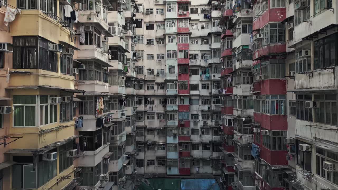 Aerial of an old apartment complex called Yick Fat on Quarry Bay, Hong Kong, China